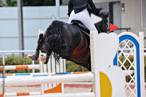 Horse Jumping, Show Jumping. to clear the obstacle. Horse hooves close-up when jumping over an obstacle