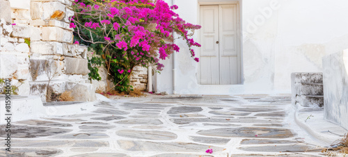 Fototapeta Naklejka Na Ścianę i Meble -  Tree with pink flowers at the entrance to the house
