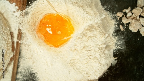 Freeze Motion of Falling Raw Egg into Flour. © Jag_cz