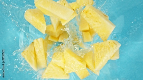 Freeze Motion of Pineapple Slices Falling into Water, Splashing. © Jag_cz