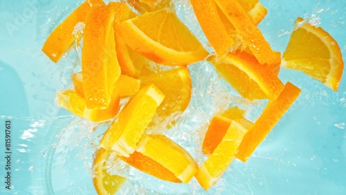 Freeze Motion of Orange Slices Falling into Water, Splashing. © Jag_cz