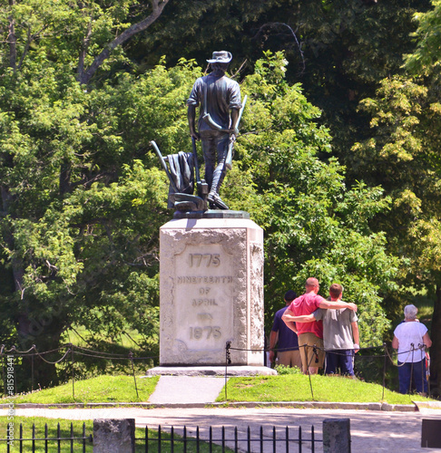 Tourists at Minute Man statue on sunny summer day, National Historical Park photo