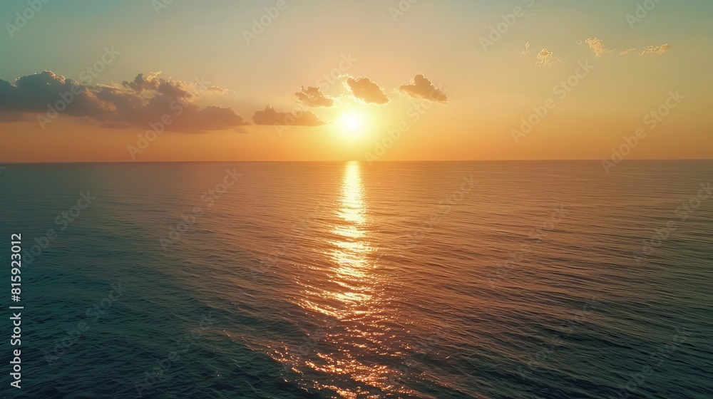 Fototapeta premium aerial view of beautiful sunset over calm sea seascape from above