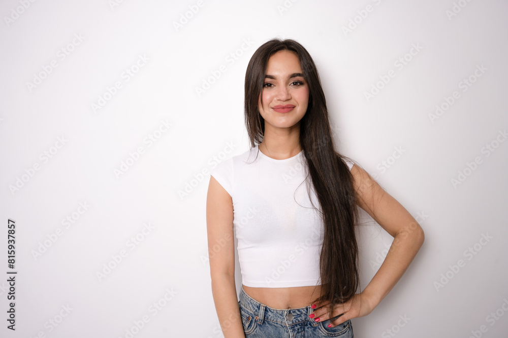 Portrait of lovely woman 20s with long hair wearing casual t-shirt smiling at you, isolated over white background Portrait of lovely woman 20s with long hair wearing casual t-shirt smiling at you, isolated over white background