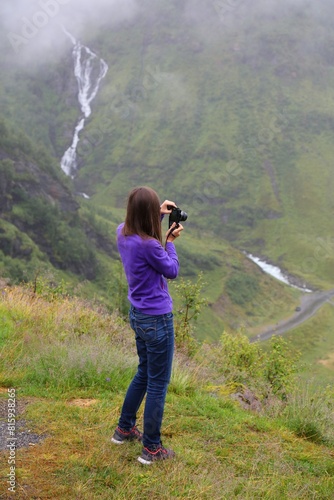 Tourist takes photos of Vestland, Norway