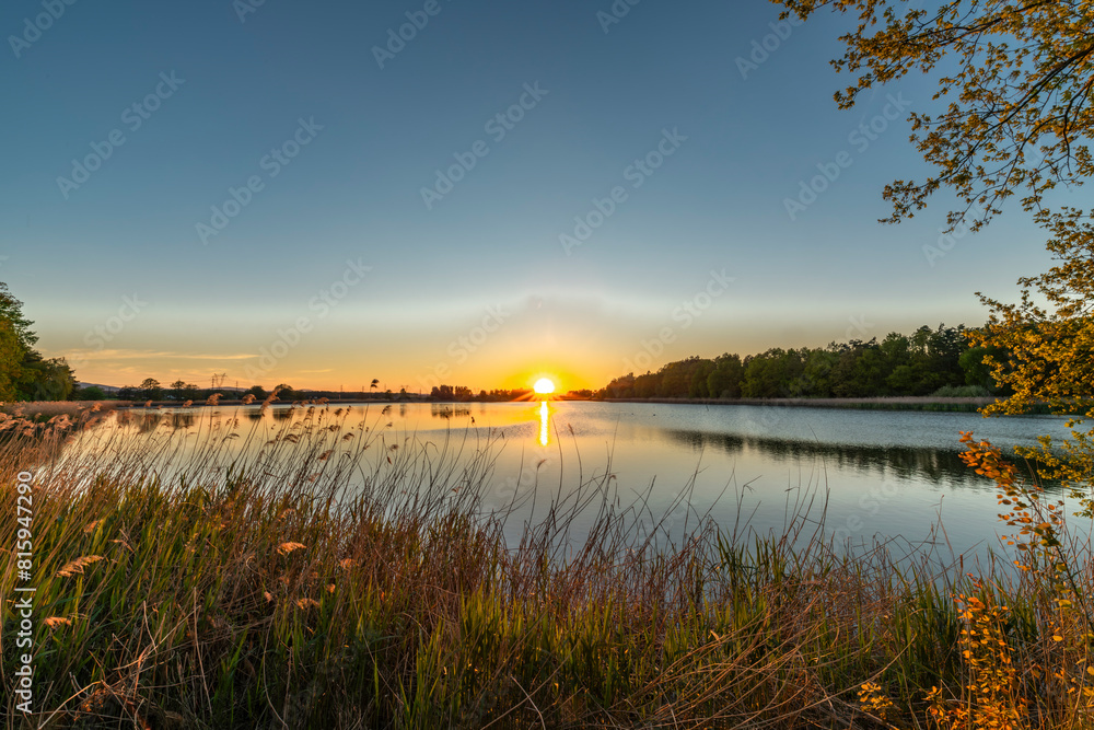 Dam between Bezdrev and Cesnovicky cip pond with spring color sunset with trees Dam between Bezdrev and Cesnovicky cip pond with spring color sunset with trees