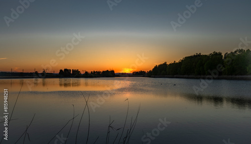 Bezdrev pond with spring color sunset from beach
