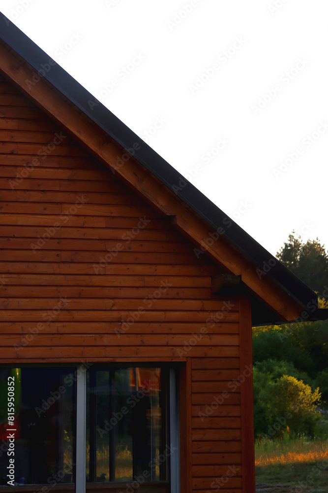 Small wooden cabin in the woods. Architectural detail, selective focus. Small wooden cabin in the woods. Architectural detail, selective focus.