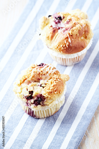 Muffins on bright wooden background. Close up. Copy space.