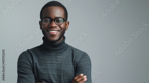 Smiling Man in Grey Turtleneck photo