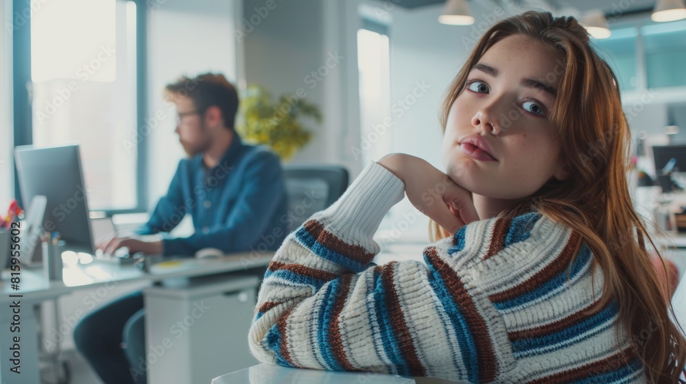 Young mixed-race entrepreneur utilizing a desktop computer at work. Businesswoman smiling at a desk is Hispanic. Businessperson daydreaming on computer Young mixed-race entrepreneur utilizing a desktop computer at work. Businesswoman smiling at a desk is Hispanic. Businessperson daydreaming on computer