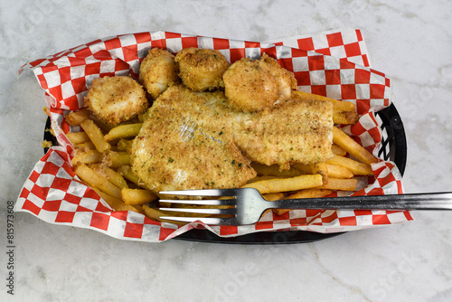 baked salmon with baked scallops and  a side of  french fries