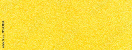 Texture of craft bright yellow paper background colors, macro. Structure of vintage kraft lemon cardboard.