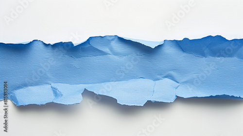 lue torn ripped piece of paper on white background photo