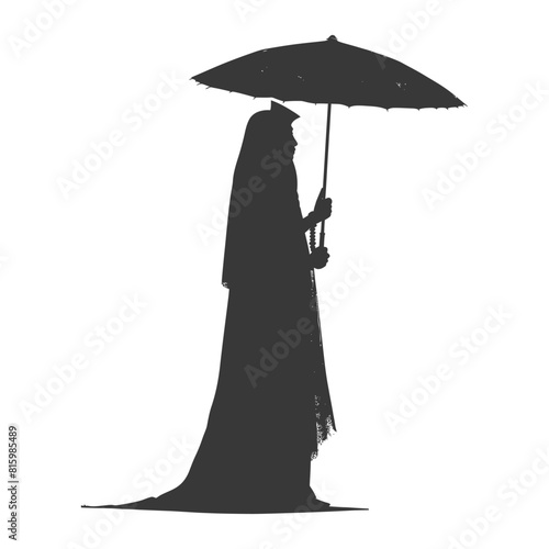 Silhouette independent egyptian women wearing tob sebleh with umbrella black color only photo
