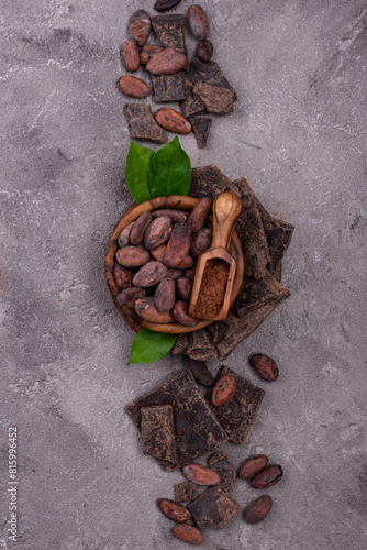 Natural cocoa powder, cocoa beans and chocolate © Yulia Furman