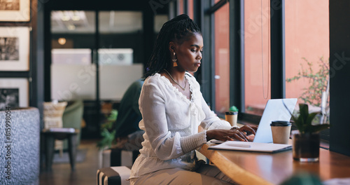 Woman, laptop and coffee shop or remote work as virtual fashion consultant, communication or email. Black person, typing and brainstorming research for online connection, engagement or social media photo