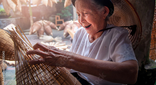 Vietnamese fishermen are doing basketry for fishing equipment at morning in Thu Sy Village, Vietnam. photo