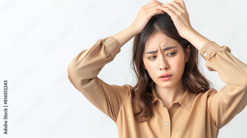 Fototapeta premium Asian woman grimacing in headache on white background.
