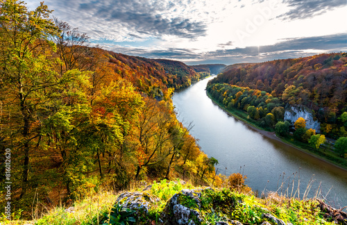 Autumn panorama with colorful foliage and Donau river near Kelheim, Bavaria (Germany). The famous “Weltenburger Enge“ narrows or Danube Gorge is a natural monument and reserve and tourist attraction.