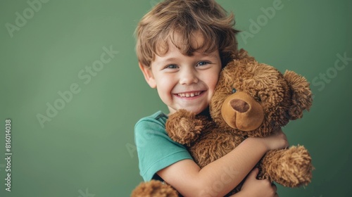Boy Hugging His Teddybear photo