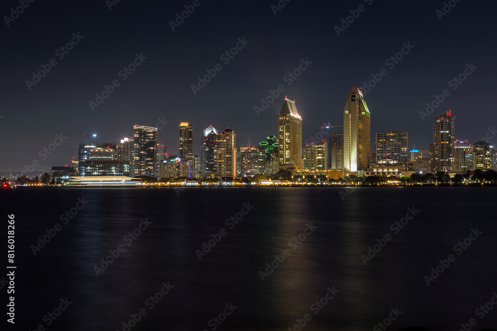Naklejka premium the iconic and breathtaking skyline of San Diego downtown at night. With a thousand lights on the big Towers