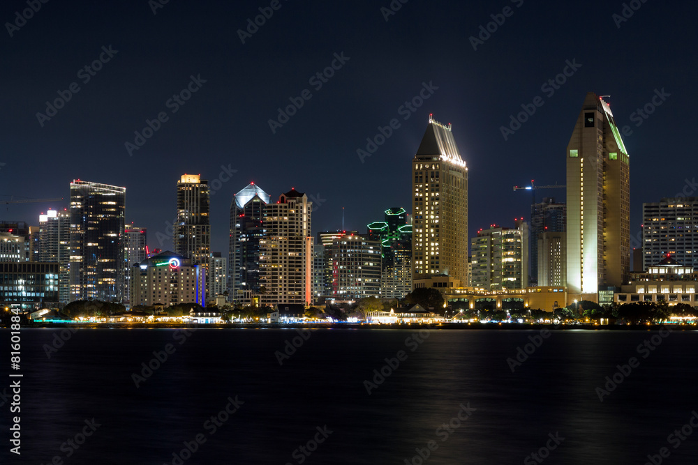 the iconic and breathtaking skyline of San Diego downtown at night. With a thousand lights on the big Towers the iconic and breathtaking skyline of San Diego downtown at night. With a thousand lights on the big Towers