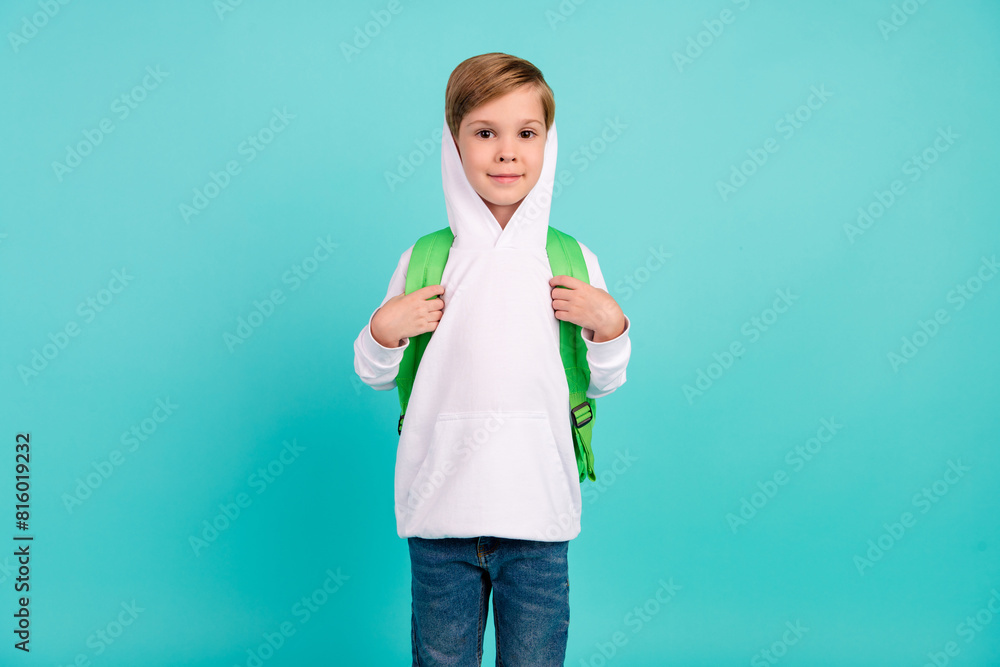 Photo of trendy cool fashionable boy ready for study at school isolated cyan color background Photo of trendy cool fashionable boy ready for study at school isolated cyan color background