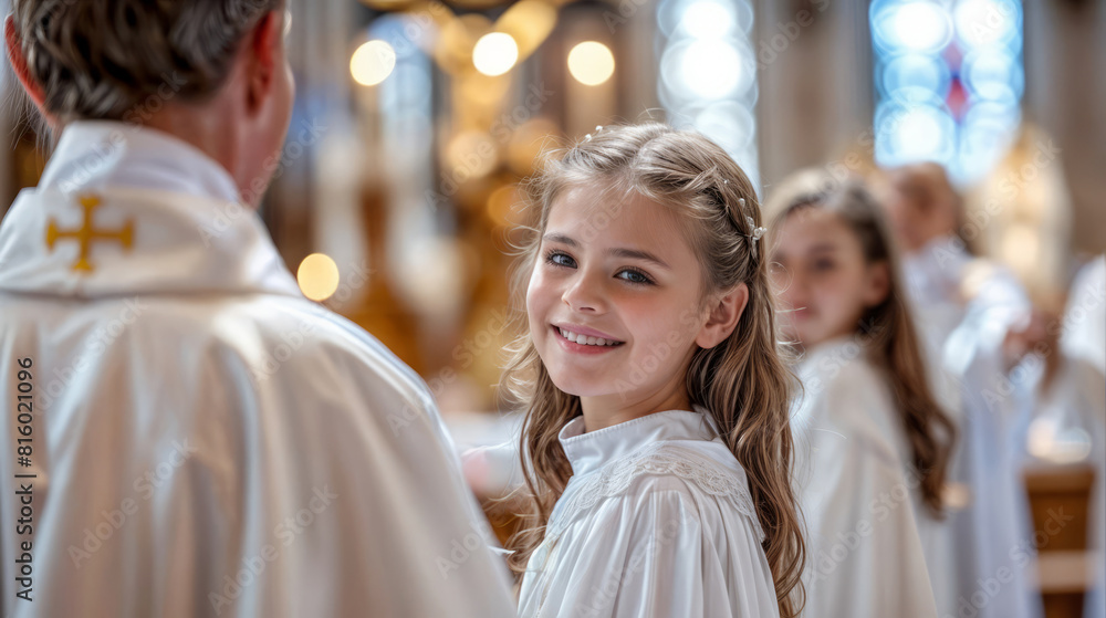 Young girl smiling during a First Communion ceremony in a church, wearing a white dress. Young girl smiling during a First Communion ceremony in a church, wearing a white dress.