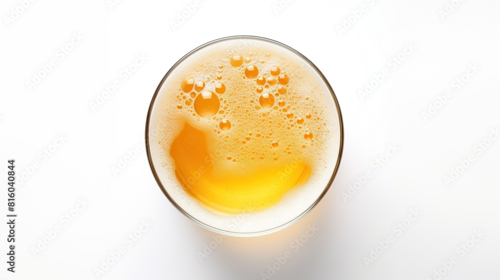 Glass of beer viewed from above with malt in the white background Glass of beer viewed from above with malt in the white background