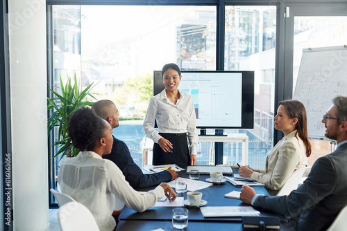 Business woman, coaching and presentation with team in meeting for discussion on corporate revenue at office. Female person or speaker talking to group of employees for profit or financial growth
