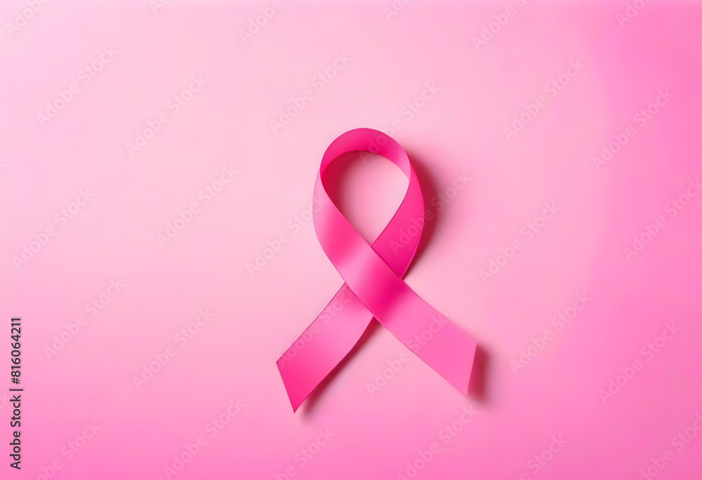A pink ribbon symbolizing World Cancer Day over a pink background A pink ribbon symbolizing World Cancer Day over a pink background