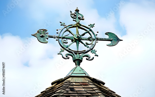 A charming weathervane spins gracefully atop the roof. 