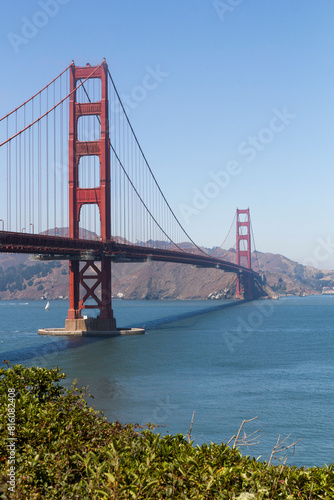 the unique and world famous Golden Gate Bridge at a clear sky sunny morning in san francisco