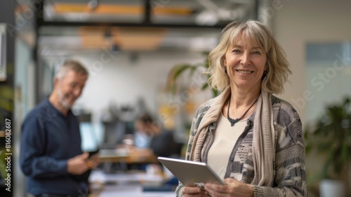 Mature Woman with Tablet in Office