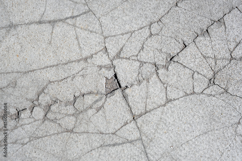 Obraz premium Gray cement surface with cracks