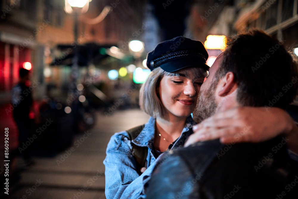 Loving couple enjoying a romantic evening stroll in the city Loving couple enjoying a romantic evening stroll in the city