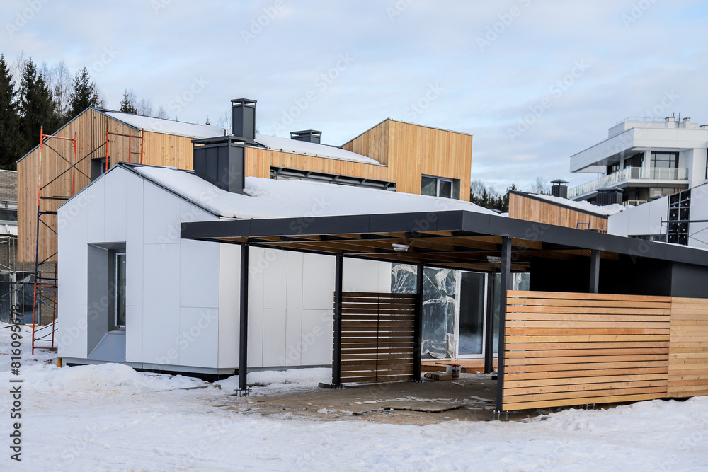 Naklejka premium Crafting Urban Living Spaces: Construction of Apartment Complexes