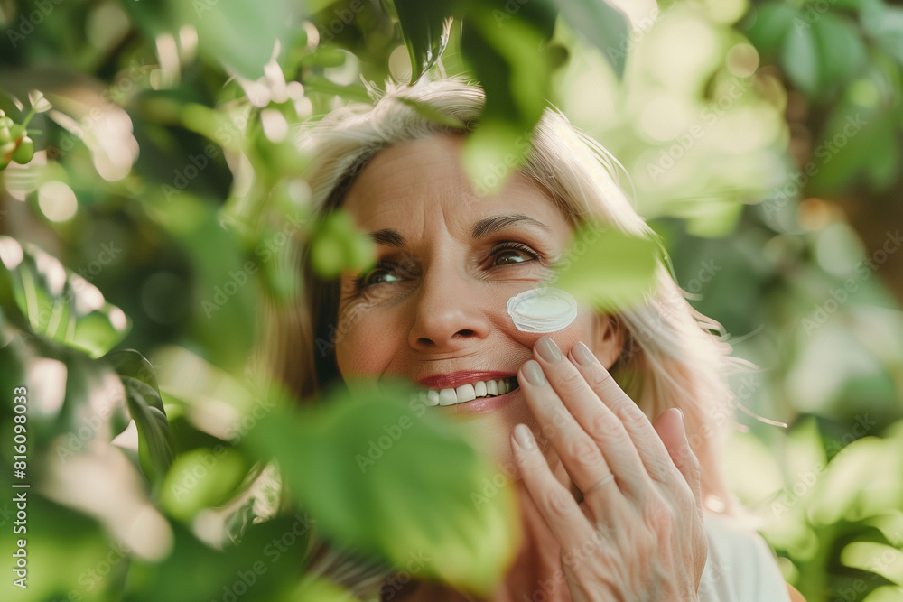 lush greenery or botanical scenery, a middle-aged woman smiling as she applies anti-aging moisturizer cream with SPF to her face, surrounded by the beauty of nature. Rejuvenation a lush greenery or botanical scenery, a middle-aged woman smiling as she applies anti-aging moisturizer cream with SPF to her face, surrounded by the beauty of nature. Rejuvenation a