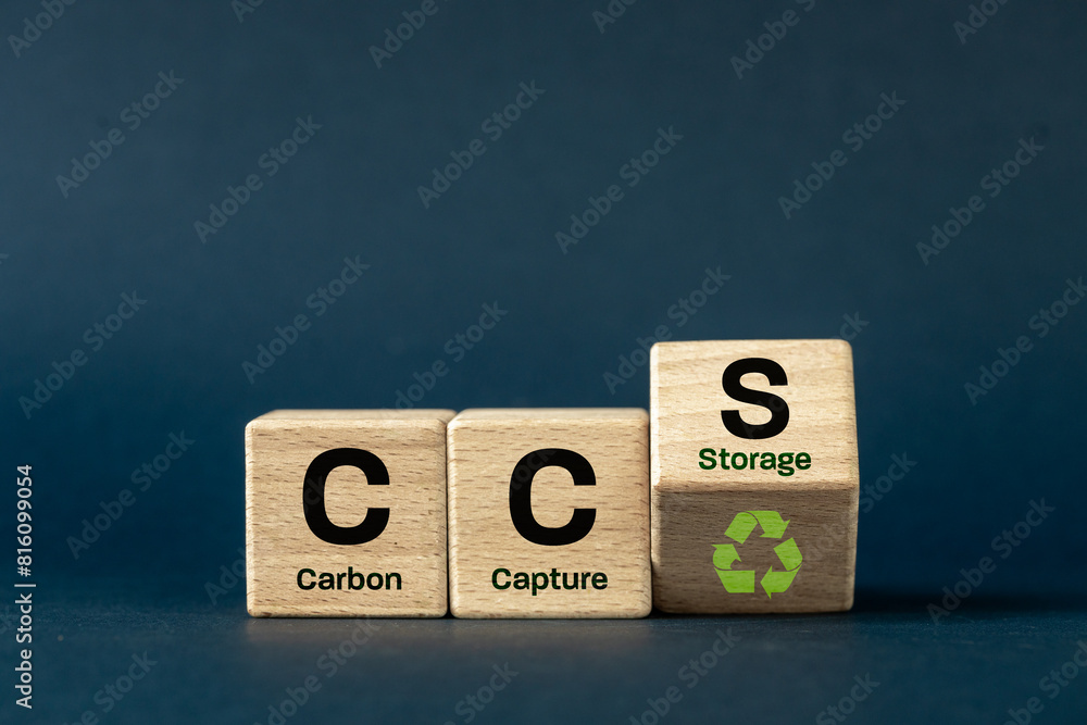 CCS Carbon capture storage symbol. Concept words CCS Carbon capture storage,ecological icon and text on wooden blocks. navy blue background. Business eco Carbon capture storage concept. Copy space.