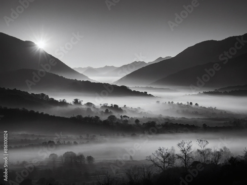 Spectacular Sunrise Over Misty Mountains, A Black and White Panorama.