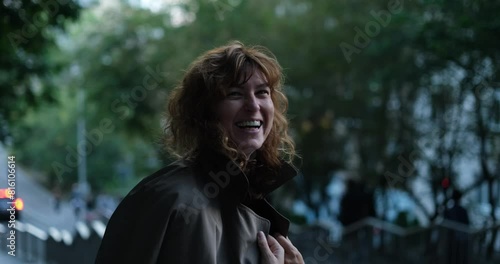 Female person or model outdoor with making fooling or making laugh concept. Smiling laughing of caucasian woman happy in a city urban view