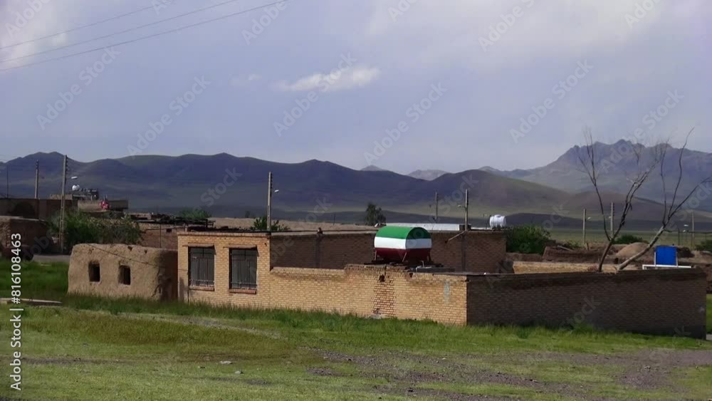 a village surrounded by lush green landscape filled with green trees, with a stone wall running through the center. a village surrounded by lush green landscape filled with green trees, with a stone wall running through the center.