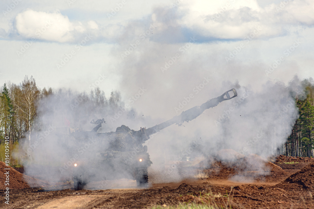 firing self propelled howitzer in the smoke firing self propelled howitzer in the smoke