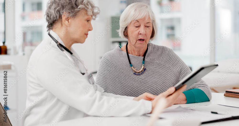 Obraz premium Senior doctor, tablet and consulting patient for healthcare advice, prescription or diagnosis at hospital. Mature medical professional talking to elderly female person on technology for consultation
