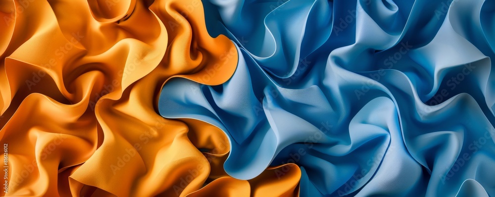 Fototapeta premium Vibrant Blue and Orange Silk Fabrics Undulating in Elegant Waves
