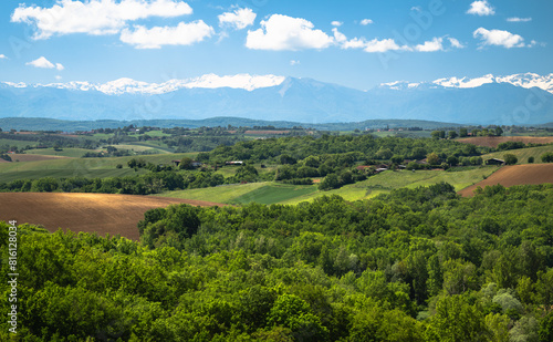 Landscape of southwestern France in Gers department with the Pyrenees mountains in the background