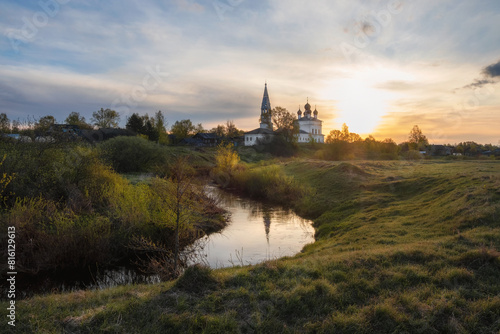Morning landscape, sunrise on the river with monastery.