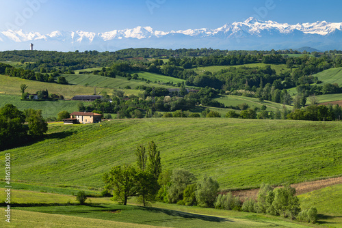 Landscape of southwestern France in Gers department with the Pyrenees mountains in the background