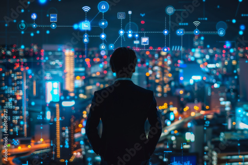 A man in a suit looks out over a city at night